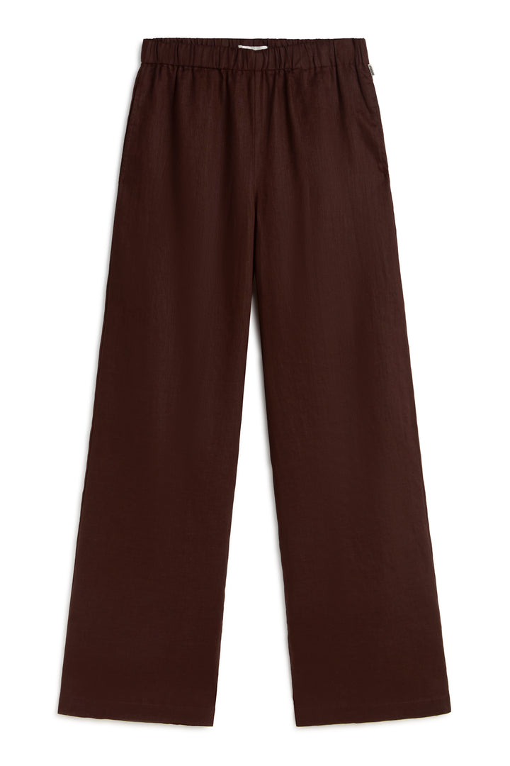 Un pantalón de Ecoalf largo y suelto marrón oscuro sostenible de cintura elástica, de diseño sencillo.
